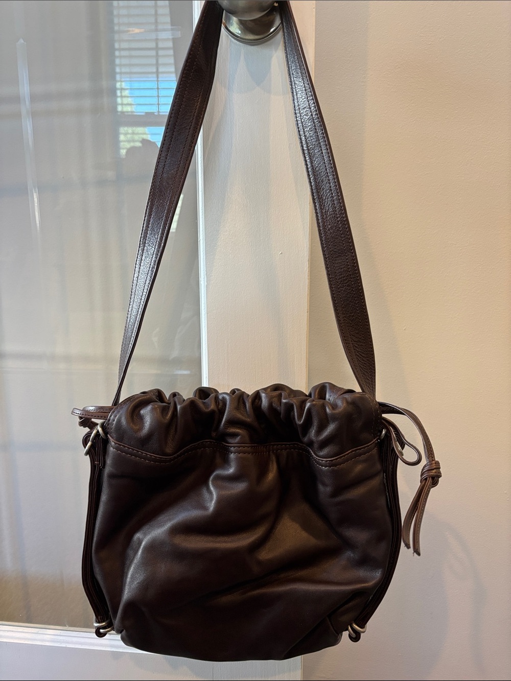 Leather Drawstring Shoulder Bag in Dark Brown also small backpack